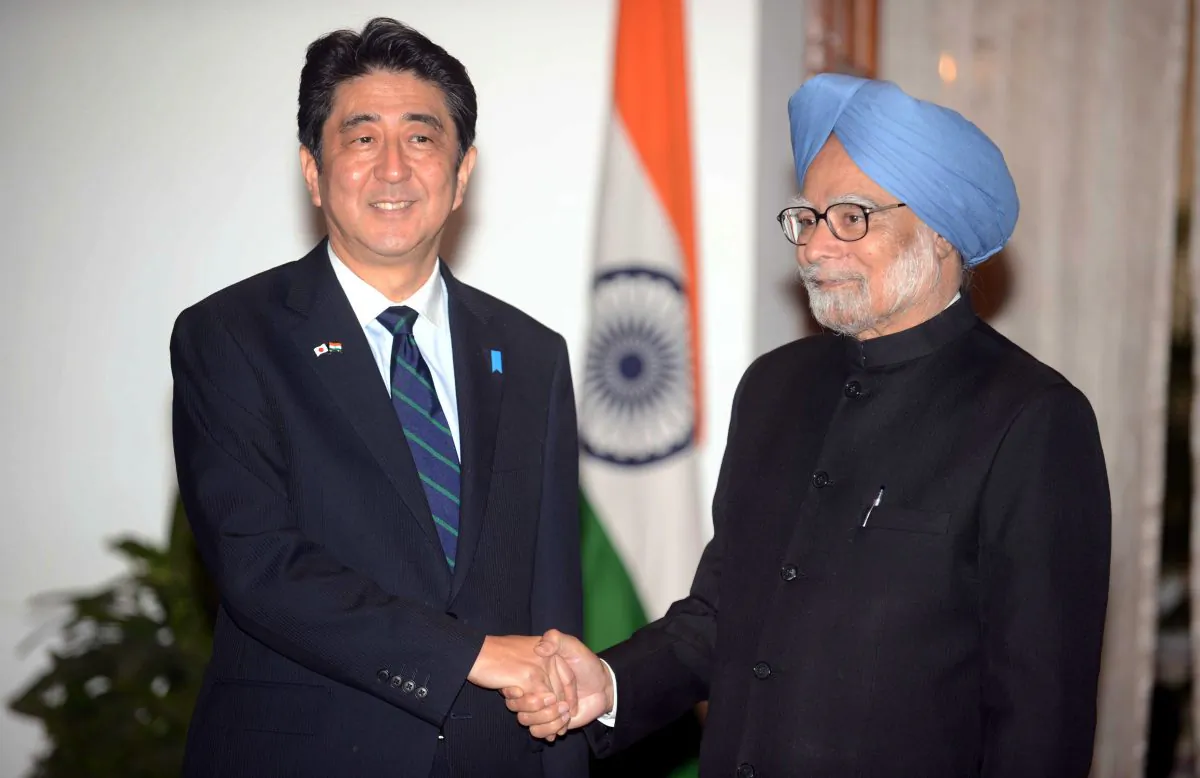 Indian Prime Minister Manmohan Singh (R) shakes hands with Japanese Prime Minister Shinzo Abe during Abe’s three-day official visit in New Delhi on Jan. 25, 2014. (Raveendran/AFP/Getty Images)
