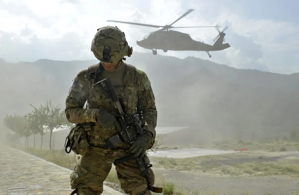 A soldier from the U.S. Army's Bravo Company 2nd battalion 27th infantry regiment secures a landing zone for a Blackhawak helicopter at the Shigal district center in Kunar province on September 15, 2011. (Tauseef Mustafa/AFP/Getty Images)