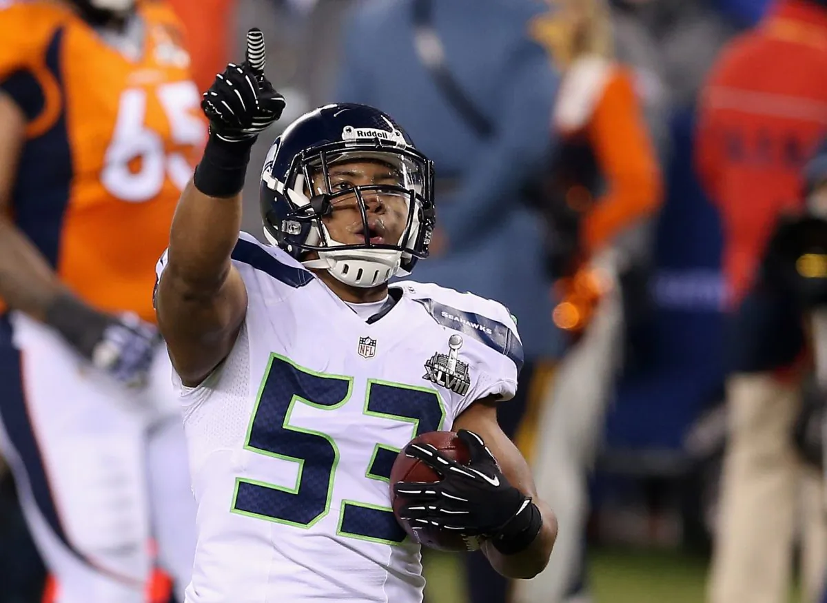 Malcolm Smith #53 of the Seattle Seahawks celebrates running back an interception off Peyton Manning of the Denver Broncos during the second quarter of Super Bowl XLVIII. (Christian Petersen/Getty Images)
