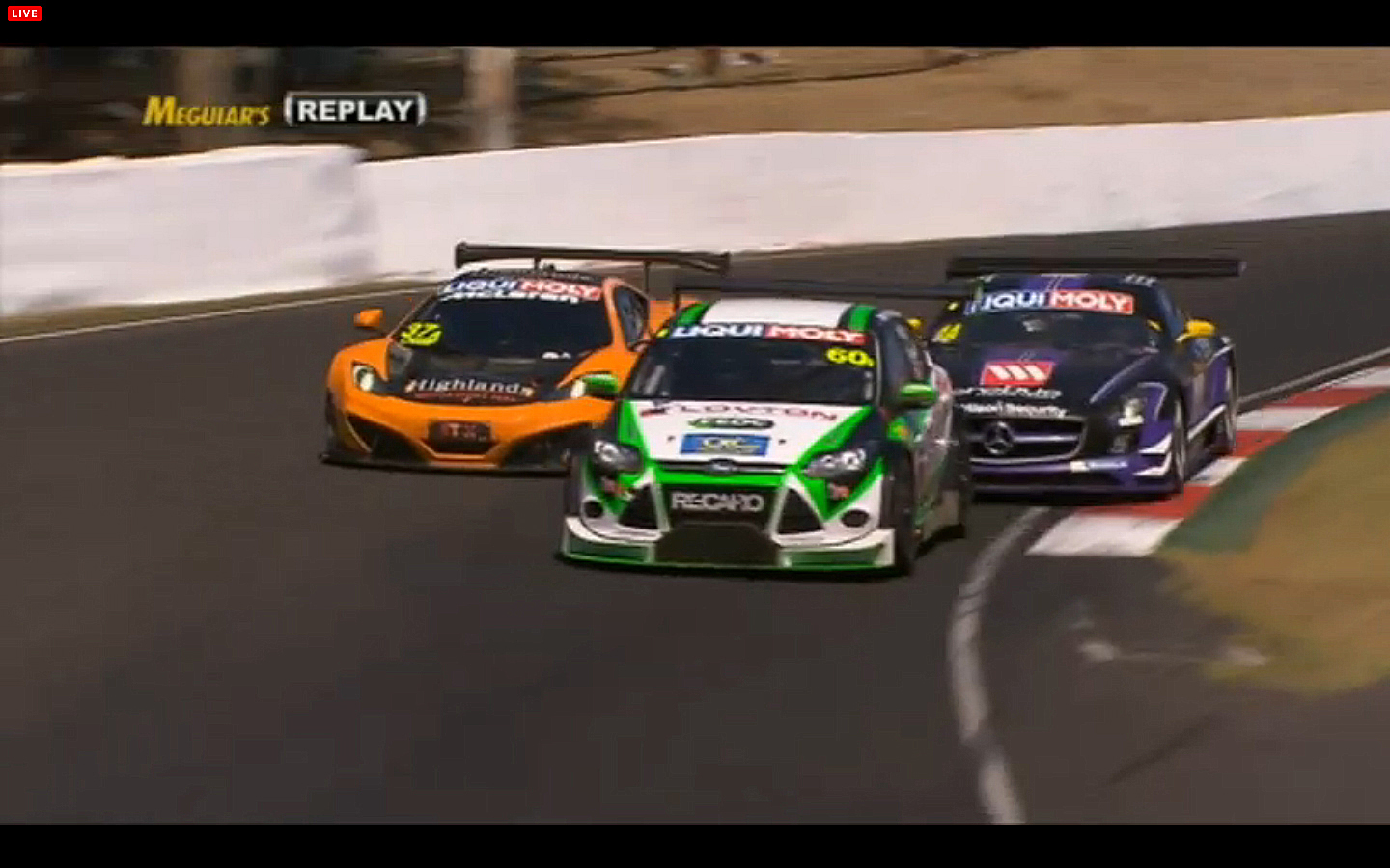 Shane Van Gisengerg in the #37 McLaren tries to use traffic to pass Bernd Schneider in the #1 Mercedes. (bathurst12hour.com.au) Shane Van Gisengerg in the #37 McLaren tries to use traffic to pass Bernd Schneider in the #1 Mercedes. (bathurst12hour.com.au)