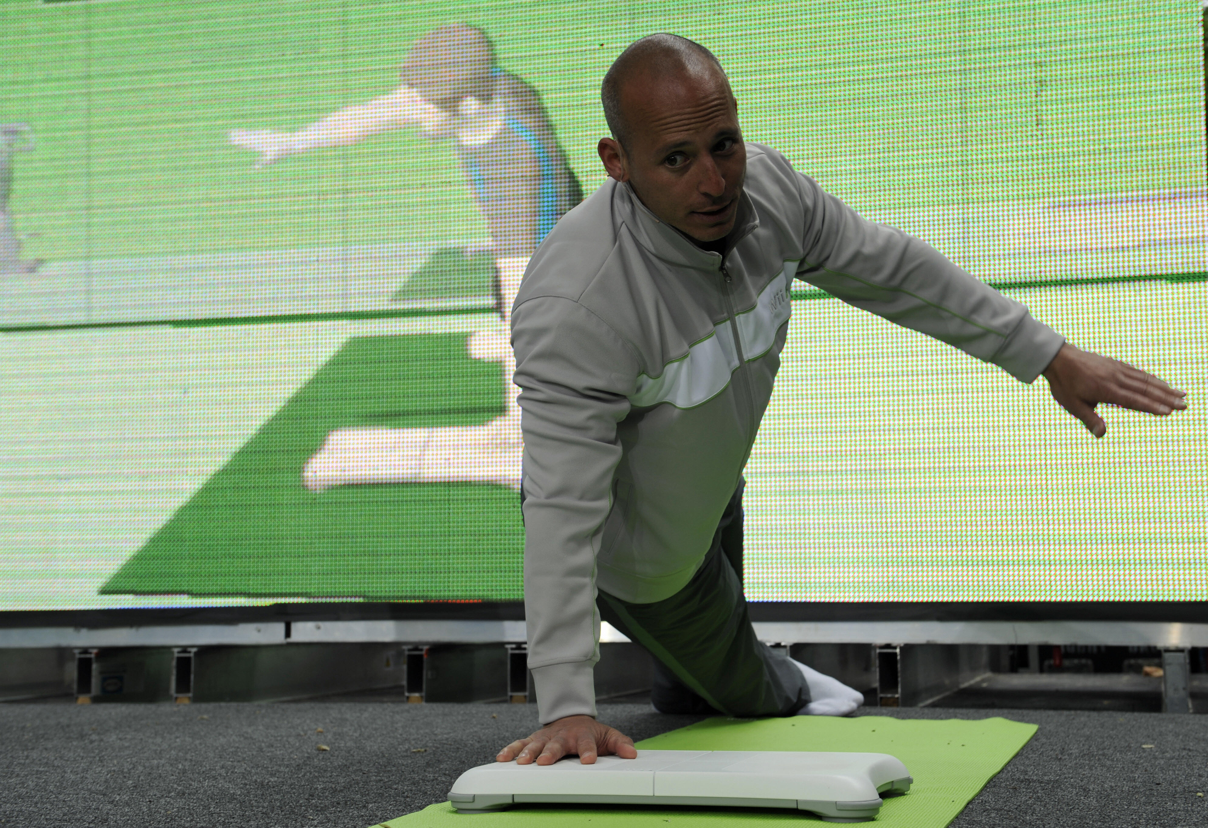 A fitness trainer demonstrates exercising with the Wii Fit, Japanese game console maker Nintendo's latest extension to its popular Wii game console, during an event to mark the Wii Fit launch in New York, May 19, 2008. (Emmanuel Dunand/AFP/Getty Images) A fitness trainer demonstrates exercising with the Wii Fit, Japanese game console maker Nintendo's latest extension to its popular Wii game console, during an event to mark the Wii Fit launch in New York, May 19, 2008. (Emmanuel Dunand/AFP/Getty Images)
