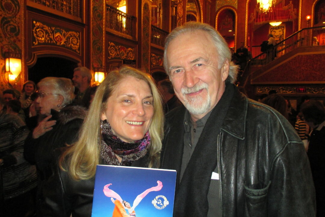 David Pottie (R), owner and editor of Sound Waves Magazine, with his companion enjoy Shen Yun Performing Arts at the Providence Performing Arts Center, Feb. 23. (Catherine Yang/Epoch Times)