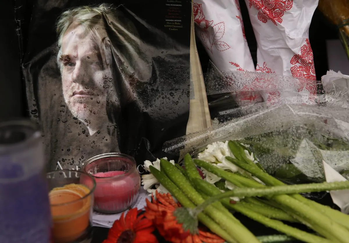 A makeshift memorial is seen, Feb. 3, 2014, outside the building where the body of actor Philip Seymour Hoffman was found in New York. (AP Photo/Seth Wenig)