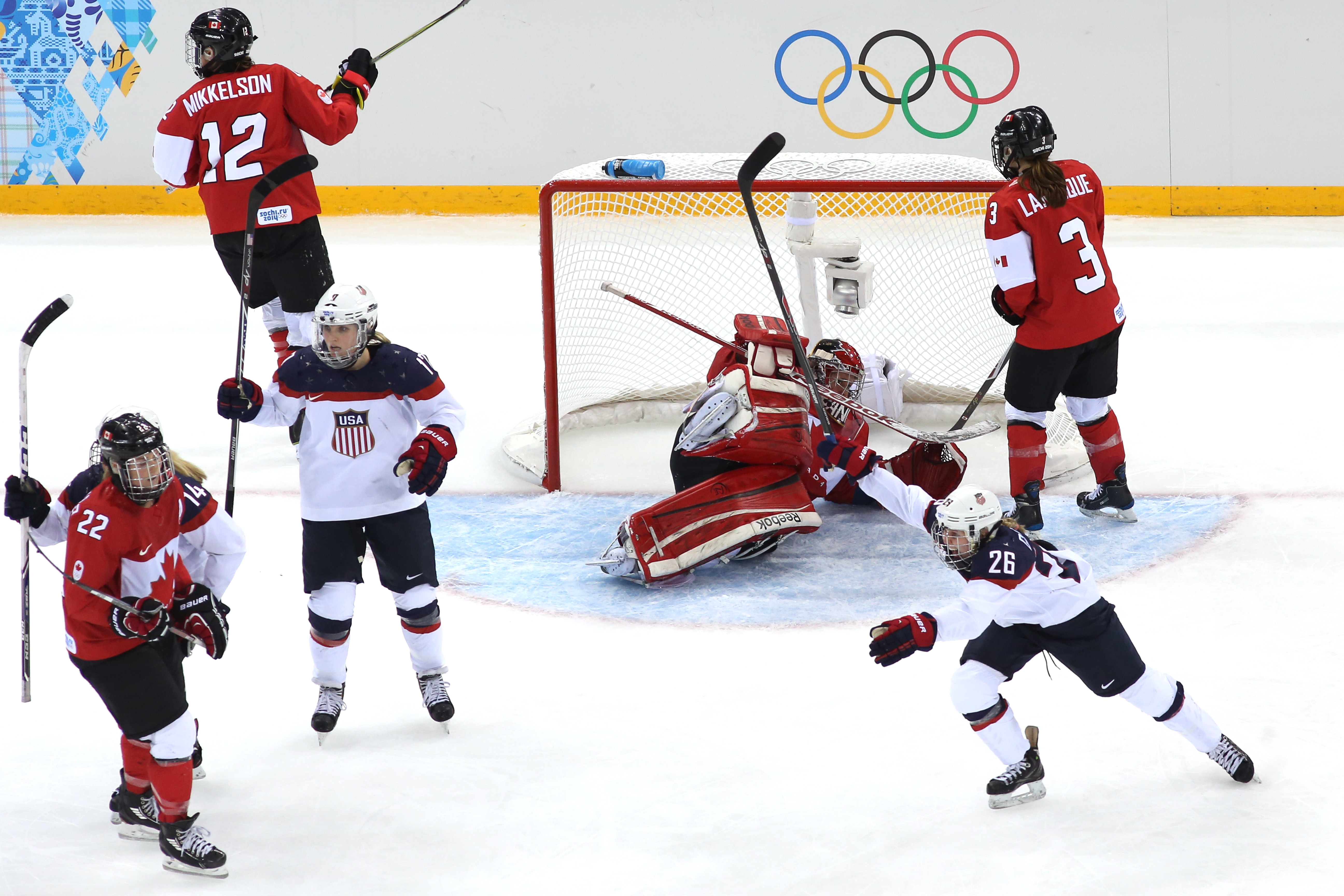 Kendall Coyne #26 of the United States celebrates as #32 Charline Labonte of Canada allows a goal by Anne Schleper #15 in the third period during the U.S.-Canada Women's Ice Hockey Preliminary Round Group A game. (Bruce Bennett/Getty Images) Kendall Coyne #26 of the United States celebrates as #32 Charline Labonte of Canada allows a goal by Anne Schleper #15 in the third period during the U.S.-Canada Women's Ice Hockey Preliminary Round Group A game. (Bruce Bennett/Getty Images)