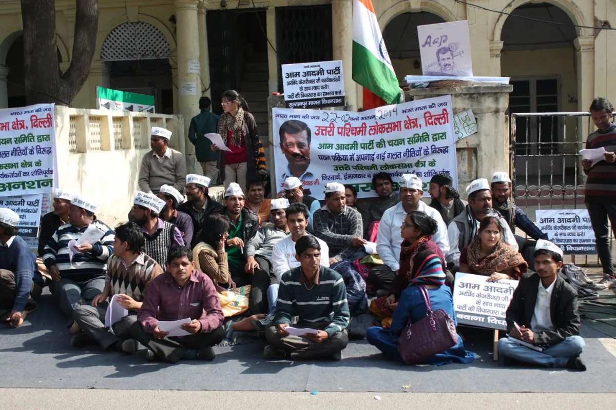 Workers of India's youngest political party, the Common People's Party, protest outside its office at Hanuman road in New Delhi on February 24, 2014. The protesters are demanding that the party must choose its candidates for elections to India's lower house of parliament by consulting them. (Venus Upadhayaya/Epoch Times)
