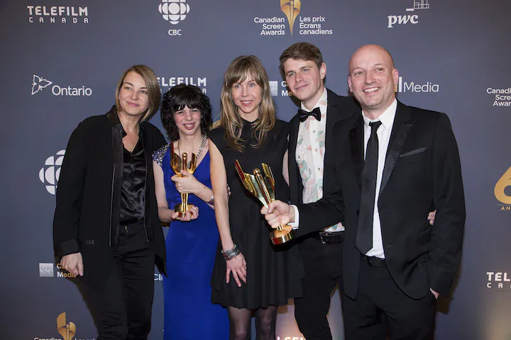 The cast and crew of Gabrielle celebrate the film's Best Picture award. (L-R) Producer Kim McGraw, Best Actress winner Gabrielle Marion-Rivard, director Louise Archambault, and producer Luc Déry. (Evan Ning/Epoch Times)