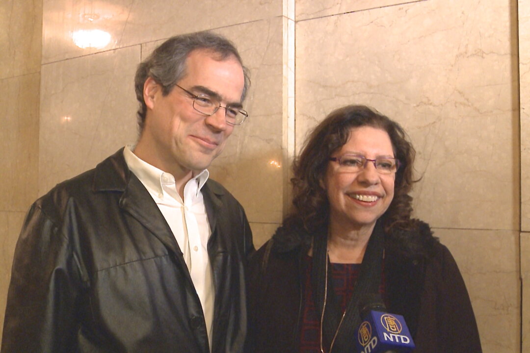 Mr. John Richetta and Ms. Augusta Riberio enjoy Shen Yun Performing Arts at the Citi Wang Theatre, Mar. 2. (Courtesy of NTD Television)