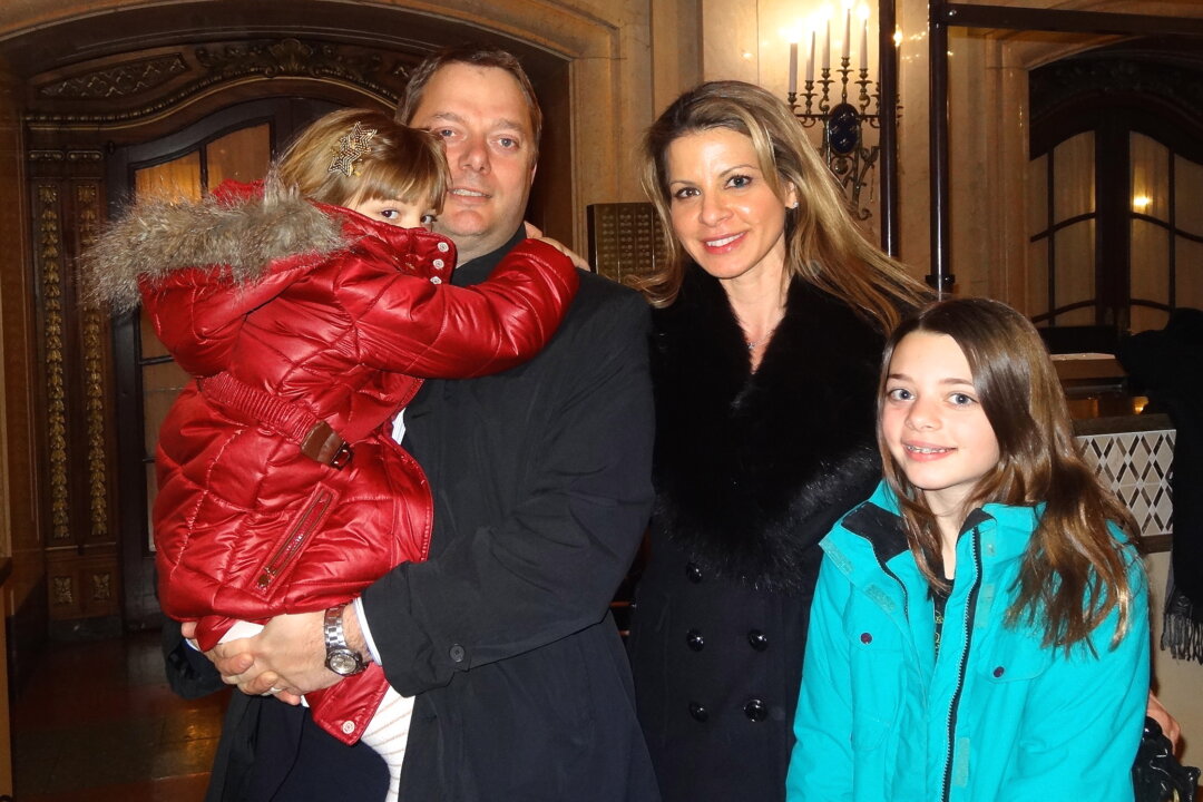 Kristian and Katrina Kristensen attend Shen Yun Performing Arts at Citi Wang Theatre in Boston, Mass., on March 1, 2014, with their daughters Helena and Ella. (Huiwen Ji/Epoch Times)