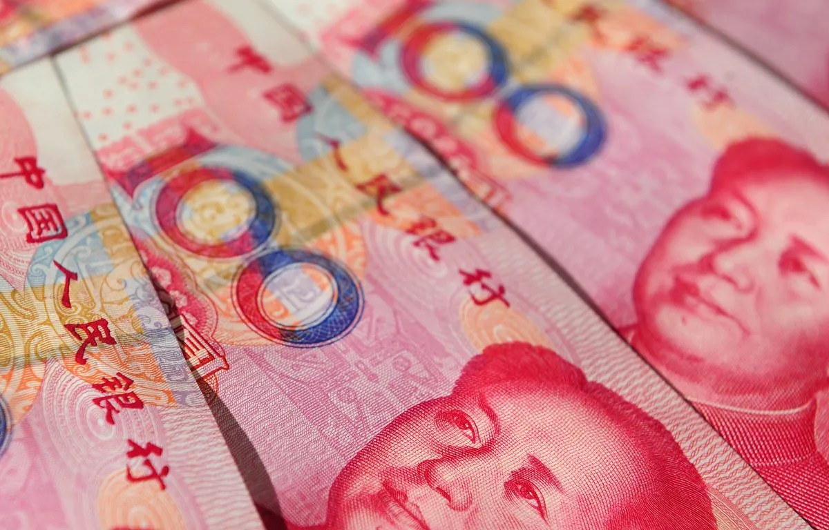 Illustration display of Chinese currency 100 Yuan notes in Beijing on June 21, 2010. A 4-year-old boy in Hunan Province was caught with 20,000 yuan ($3,257) in his schoolbag, which he planned to gamble while playing cards. (Frederic J. Brown/AFP/Getty Images)