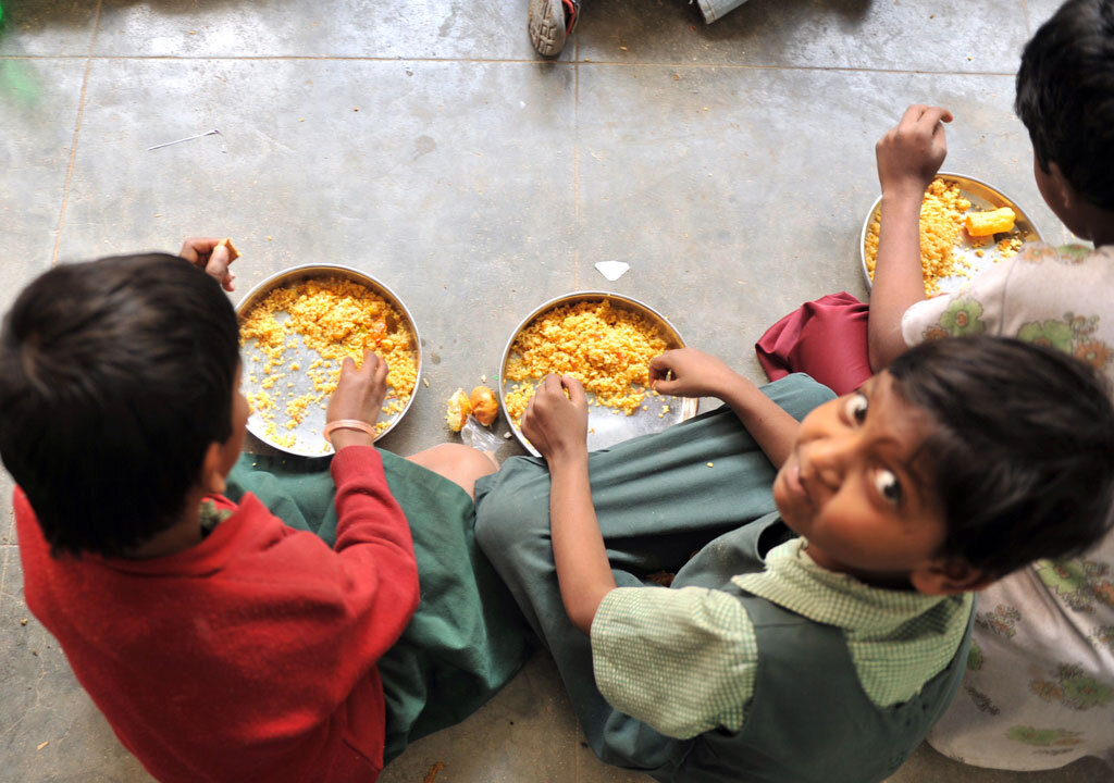 Indian children eat their mid-day meal at a Government High School in Hyderabad, on January 10, 2012. Levels of under-nutrition in the country were 'unacceptably high' despite impressive GDP growth, Prime Minister Manmohan Singh said on January 10, 2012 and added that the problem of malnutrition was a 'national shame'. (Noah Seelam/AFP/Getty Images)