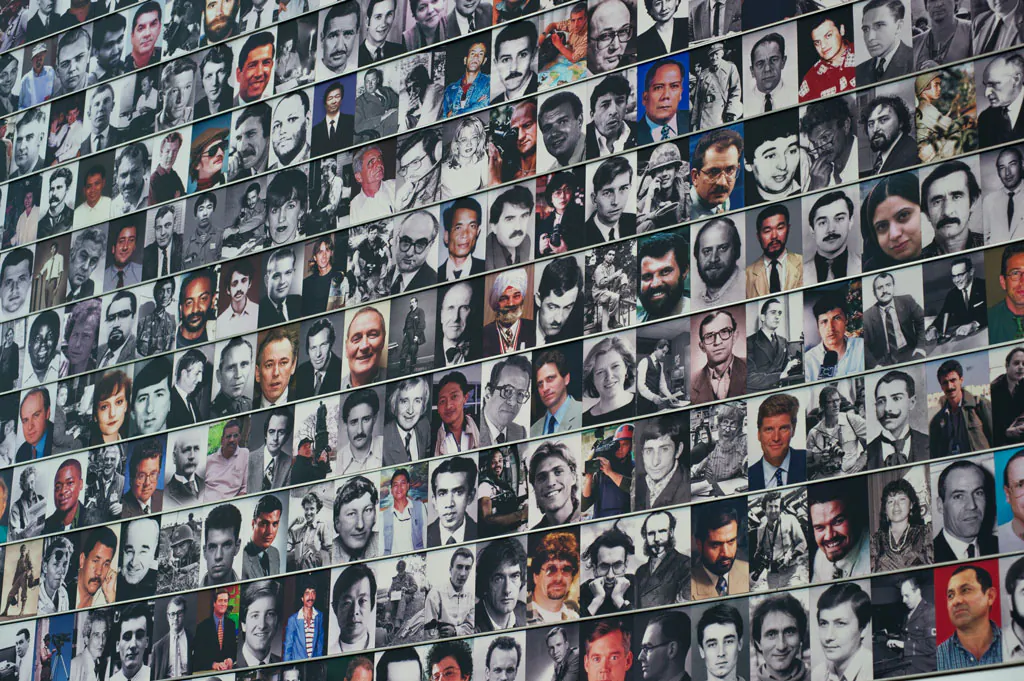 Faces of fallen journalists displayed at the Journalists memorial wall at the Newseum in Washington (Karen Bleier/AFP/GettyImages)