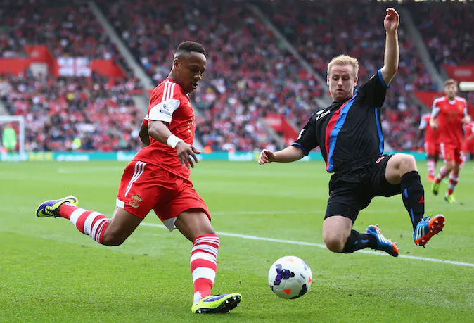 Nathaniel Clyne of Southampton battles for the ball with Dean Moxey of Crystal Palace during the Barclays Premier League match between Southampton and Crystal Palace at St Mary's Stadium on September 28, 2013 in Southampton, England. (Photo by Paul Gilham/Getty Images) 