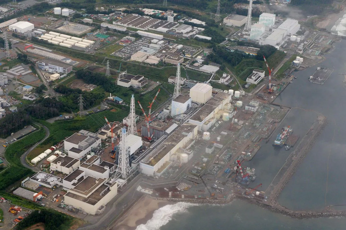 This aerial file photo taken in Aug. 2013,  shows No 4, 3, 2, 1, 5 and 6 reactors, from bottom to top, at the Fukushima Daiichi nuclear power plant in Futaba town, Fukushima Prefecture, northeastern Japan.   (AP Photo/Kyodo News, File) 