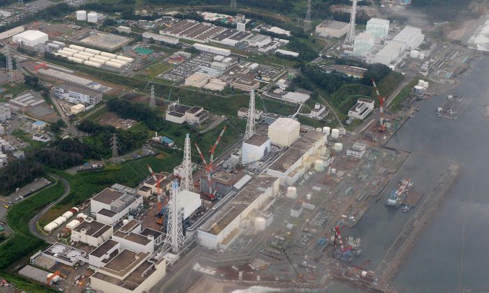 This aerial file photo taken in Aug. 2013,  shows No 4, 3, 2, 1, 5 and 6 reactors, from bottom to top, at the Fukushima Daiichi nuclear power plant in Futaba town, Fukushima Prefecture, northeastern Japan.   (AP Photo/Kyodo News, File) 