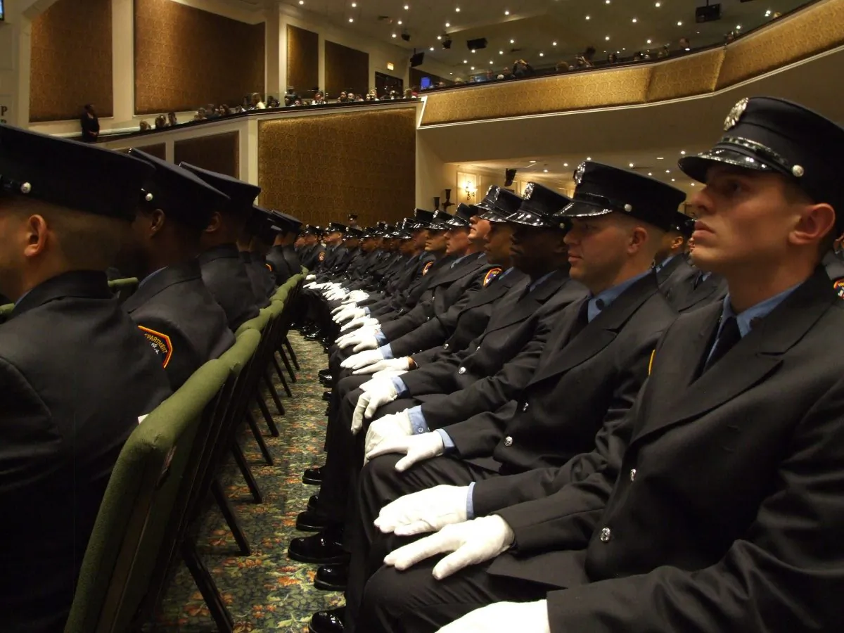 Probationary fire fighters sit during a graduation ceremony at the Christian Cultural Center in New York, Dec. 5, 2013. Their graduating class was the most diverse in Fire Department history with 62 percent minorities. (Holly Kellum)