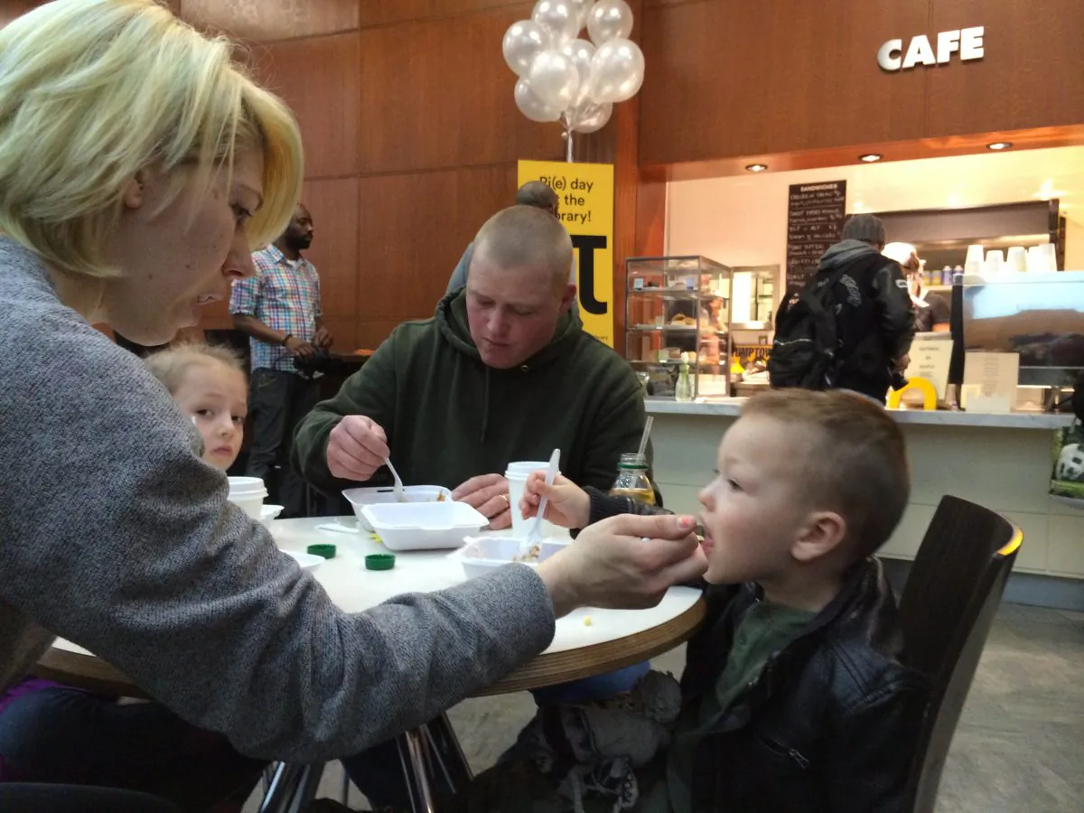 On International Pi Day, the Wilklow family enjoys salted caramel apple pie at a cafe inside the Brooklyn Public Library. (Matt Gnaizda)
