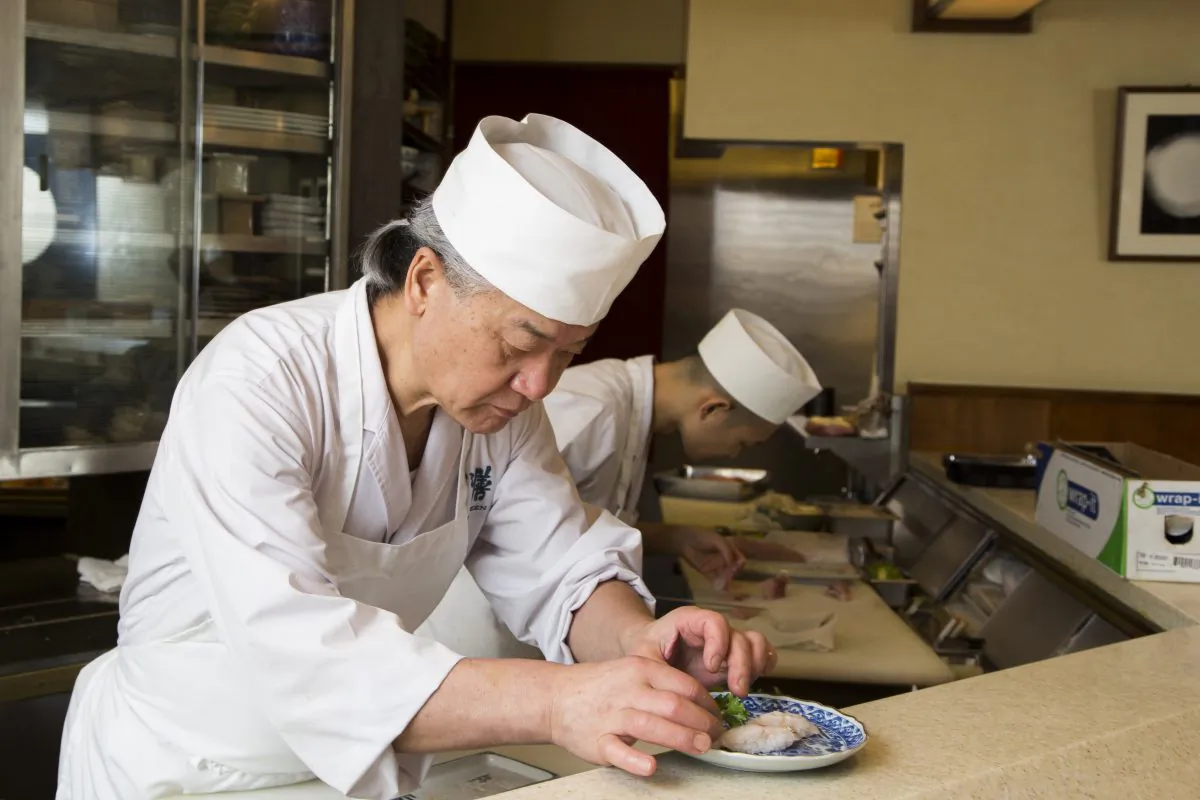 Toshio Suzuki, owner and chef of Sushi Zen, prepares a plate of blackthroat sea perch sushi. (Samira Bouaou/Epoch Times)