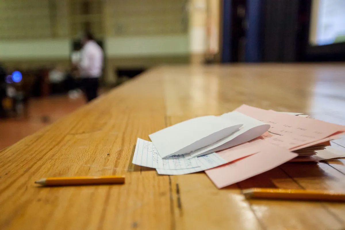A pile of questions from parents at an info session for prekindergarten admission at the High School of Fashion Industries, Manhattan, New York, Mar. 3, 2014. (Petr Svab/Epoch Times)