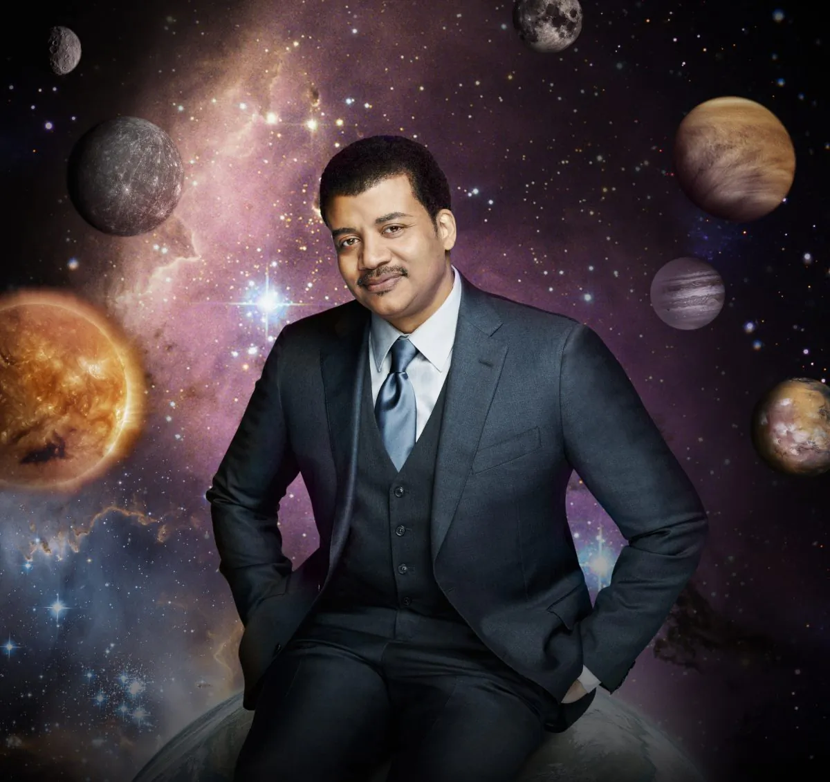 This photo released by Fox shows Neil deGrasse Tyson, the astrophysicist who hosts the television show, "Cosmos: A Spacetime Odyssey," which premiered Sunday, March 9, 2014 on Fox and simultaneously across multiple U.S. Fox networks. The series explores how we discovered the laws of nature and found our coordinates in space and time.  (AP Photo/Fox, Patrick Eccelsine)