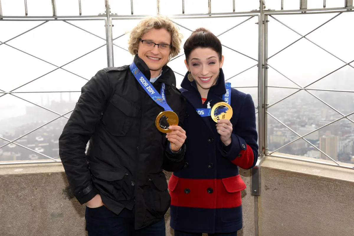 Olympic gold medalist ice dancers Meryl Davis and Charlie White, left, visit the Empire State Building on Thursday, Feb. 27, 2014 in New York. (Photo by Evan Agostini/Invision/AP)