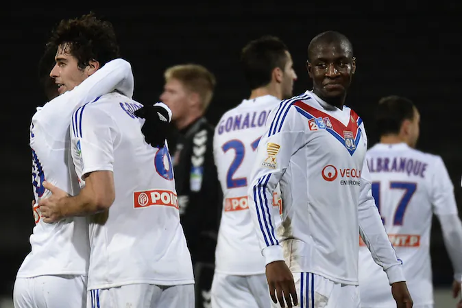 Lyon's French midfielder Yoann Gourcuff (2nd L) celebrates with his teammates after scoring a goal during the French League Cup football match Olympique Lyonnais (OL) vs FC Reims (FCR) on December 18, 2013, at the Gerland Stadium in Lyon, central-eastern France. (JEFF PACHOUD/AFP/Getty Images)