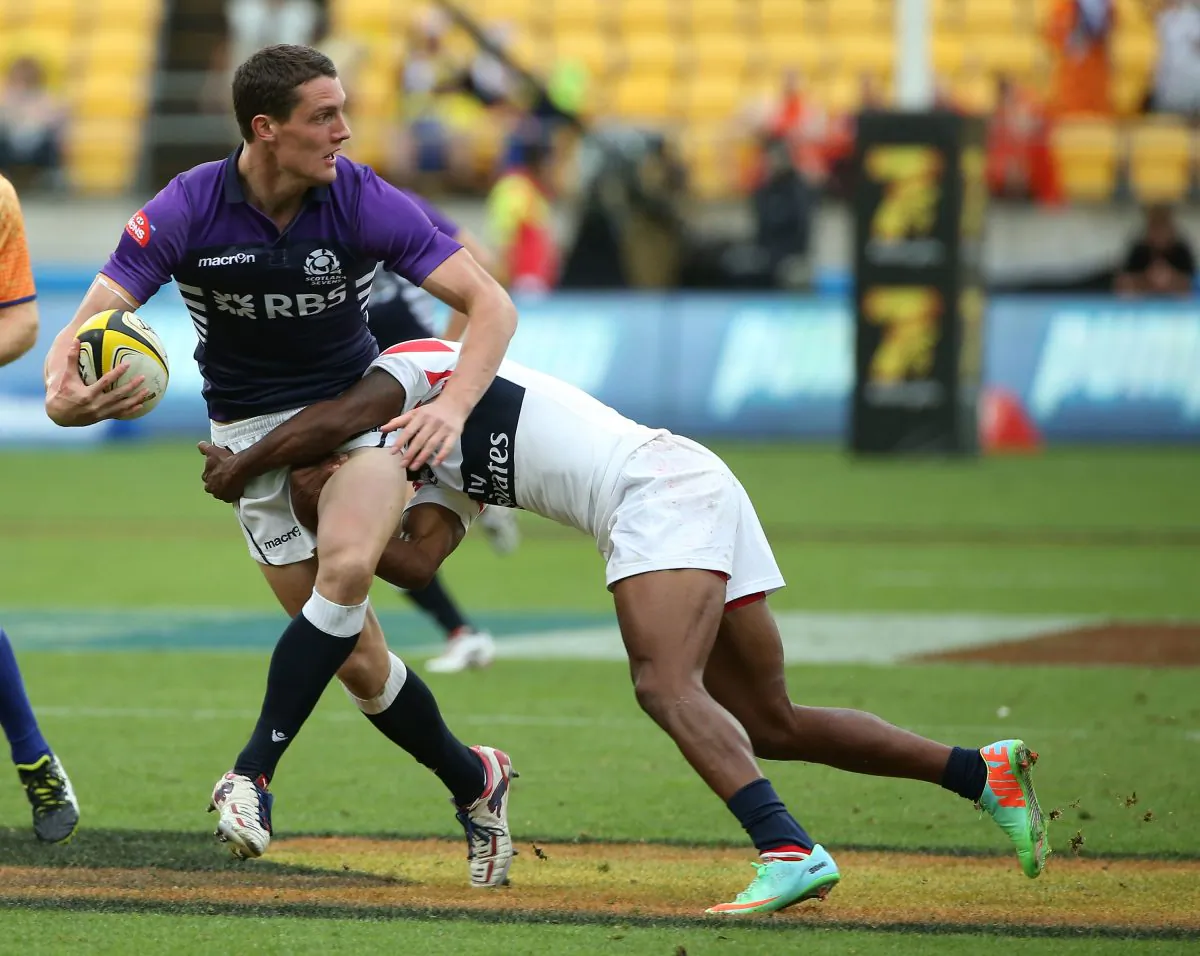Scotland's Gregor Young is tackled by USA's Folau Niua (R) during the IRB Sevens World Series Pool C match between Scotland and USA at Westpac Stadium on February 7, 2014 in Wellington, New Zealand. (Fiona Goodall/Getty Images)