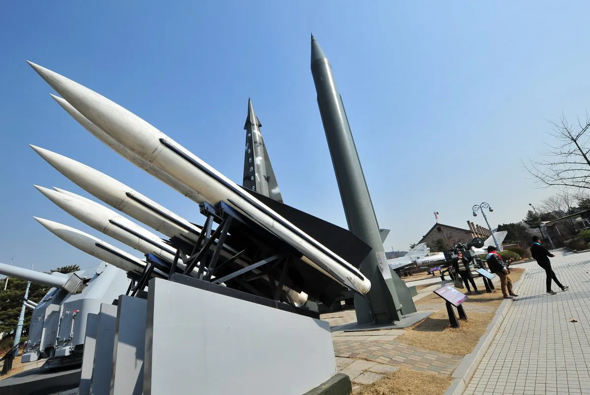 Replicas of a North Korean Scud-B missile (R) and South Korean Hawk surface-to-air missiles (L) at the Korean War Memorial in Seoul on March 3, 2014. North Korea has been firing short-range missiles off its eastern coast since late February, and one launched on Tuesday could have hit a Chinese passenger plane that flew through its trajectory seven minutes later. (Jung Yeon-Je/AFP/Getty Images)