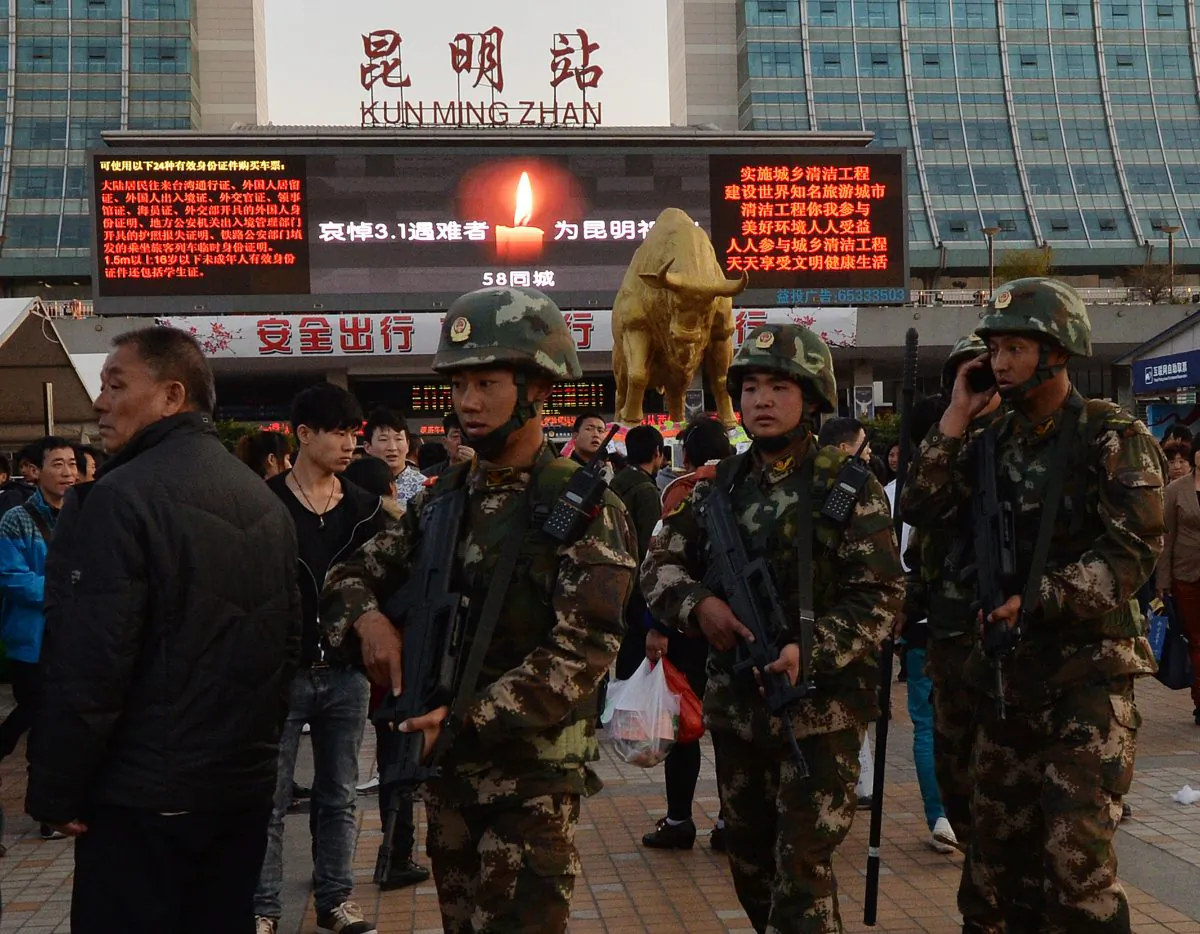 Chinese paramilitary police patrol the main train station in Kunming, Yunnan Province, on March 3, 2014, after knife-wielding assailants left at least 29 people dead. (Mark Ralston/AFP/Getty Images)