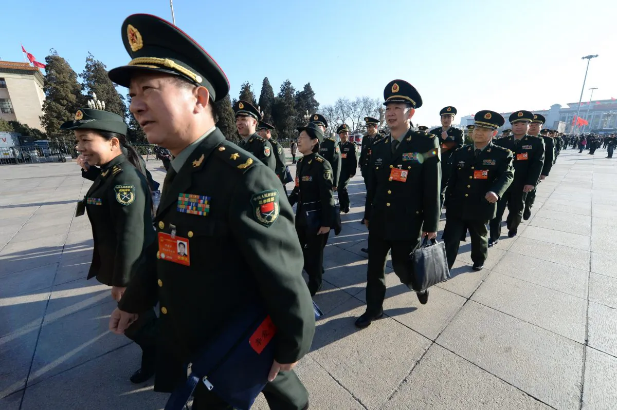 Military delegates arrive for the closing ceremony of the National People's Congress at the Great Hall of the People in Beijing on March 13, 2024. Xi Jinping, the Party leader, has appointed himself head of a new committee on military reform. (Goh Chai Hin/AFP/Getty Images)