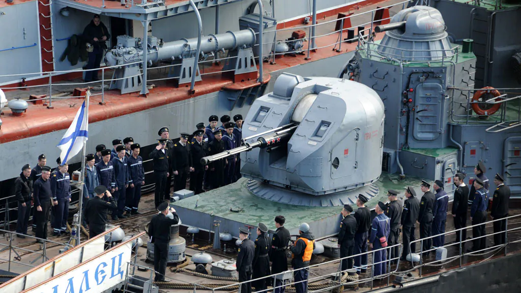 Russian navy sailors stand still during a flag-raising ceremony at the deck of their ship, the 'Suzdalets' ASW corvette, moored in the bay of the Crimean port of Sevastopol on March 27, 2014. Ukraine's maritime forces have been severely diminished by the Russian intervention in Crimea after they lost 12 of their 17 warships to Moscow, including the 'Ternopil' ASW corvette, defence analysts Jane's said yesterday. (Viktor Drachev/AFP/Getty Images)