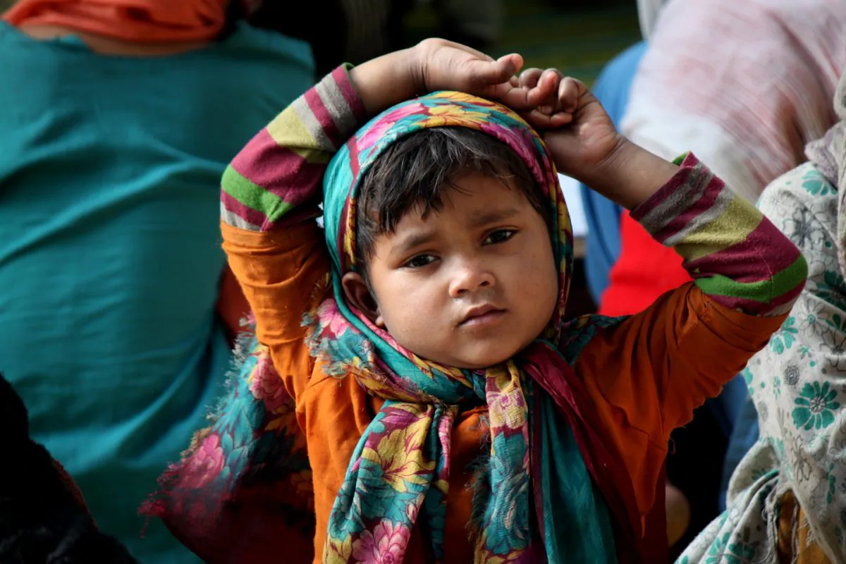 A girl of Rohingya Muslim refugees in the premises of the tomb of Rakhbour Pir Baba, a local Muslim saint, in the Narwal area of Jammu, India, on Feb. 9, 2014. According to the UN refugee agency there are 3700 Rohingya refugees and asylum seekers in Jammu, a northern Indian city. (Venus Upadhayaya/Epoch Times)