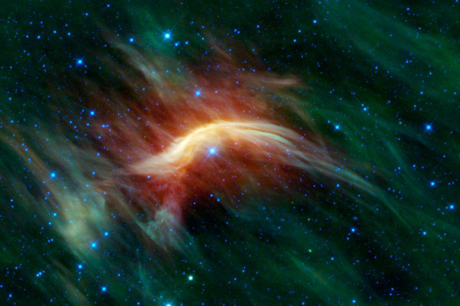 The blue star near the center of this image is Zeta Ophiuchi. When seen in visible light, it appears as a relatively dim red star surrounded by other dim stars and no dust. However, in this infrared image taken with NASA's Wide-field Infrared Survey Explorer, or WISE, a completely different view emerges. Zeta Ophiuchi is actually a very massive, hot, bright blue star plowing its way through a large cloud of interstellar dust and gas. The colors used in this image represent specific wavelengths of infrared light. (NASA/JPL-Caltech/UCLA) 