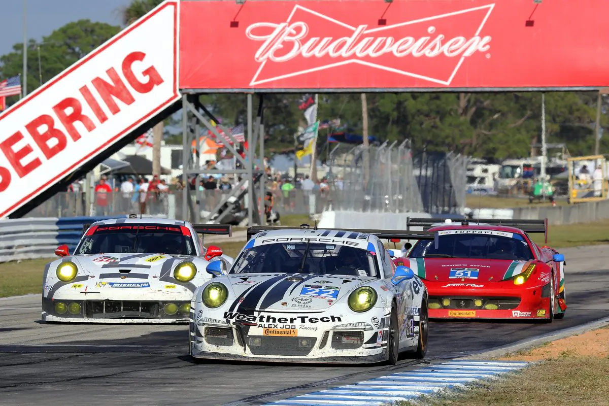 The #23 Weather Tech/AJR Porsche leads the #912 PNA Porsche (L) and the #51 Spirit of Racing Ferrari 458 (not the one involved in the incident.) (Chris Jasurek/Epoch Times)