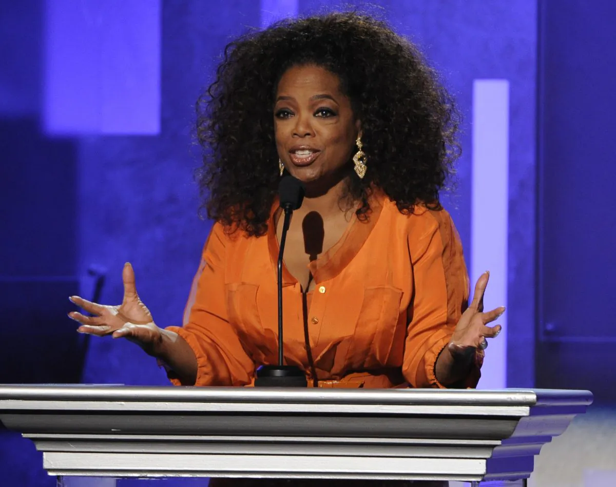FILE - This Feb. 22, 2014 file photo shows Oprah Winfrey speaking at the 45th NAACP Image Awards in Pasadena, Calif. Winfrey will visit eight cities this fall for a two-day arena event called “Oprah’s The Life You Want Weekend.” Winfrey will go on stage on a Friday night in each city, then the next day a circle of personalities she has featured on OWN and her talk show over the years will join in. Organizers said Wednesday, March 26, 2014, that the first stop will be in Atlanta the first weekend of September. (Photo by Chris Pizzello/Invision/AP, File)