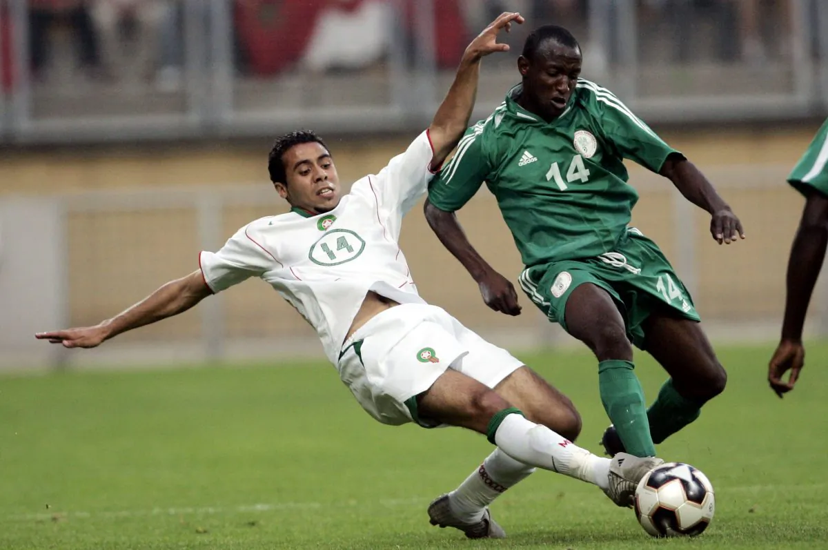 Morocco's Rachid Tiberkanine, left, challenges Nigeria's David Abwo in a file photo. (AP Photo/Yves Logghe)