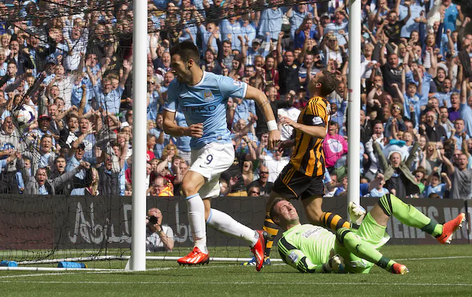 Manchester City's Alvaro Negredo, centre, wheels away to celebrate after scoring past Hull's goalkeeper Allan McGregor, bottom right, during their English Premier League soccer match at The Etihad Stadium, Manchester, England, Saturday Aug. 31, 2013. (AP Photo/Jon Super)