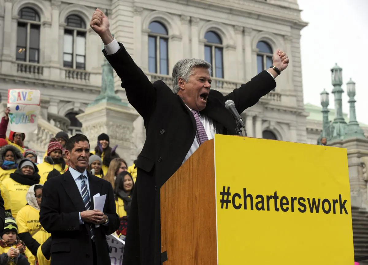 New York state Sen. Dean Skelos cheers at a rally in support of charter schools on the steps of the state Capitol in Albany, March 4. Thousands of charter school supporters from around New York state took part in the rally. (Tim Roske/AP)