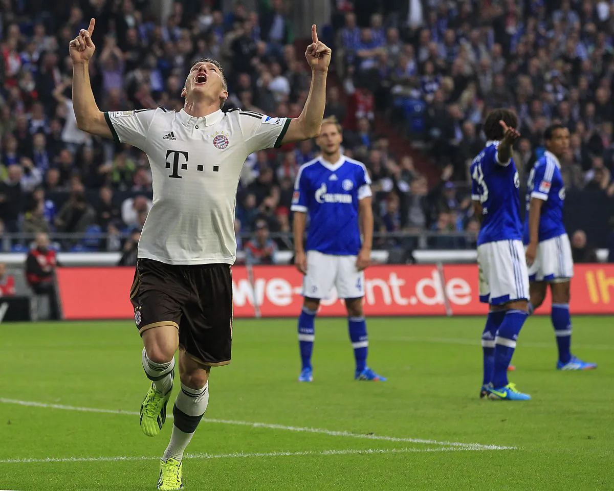 Bayern's Bastian Schweinsteiger celebrates after scoring during the German first division Bundesliga soccer match between Schalke 04 and Bayern Munich in Gelsenkirchen, Germany, Saturday, Sept. 21, 2013. (AP Photo/Frank Augstein)