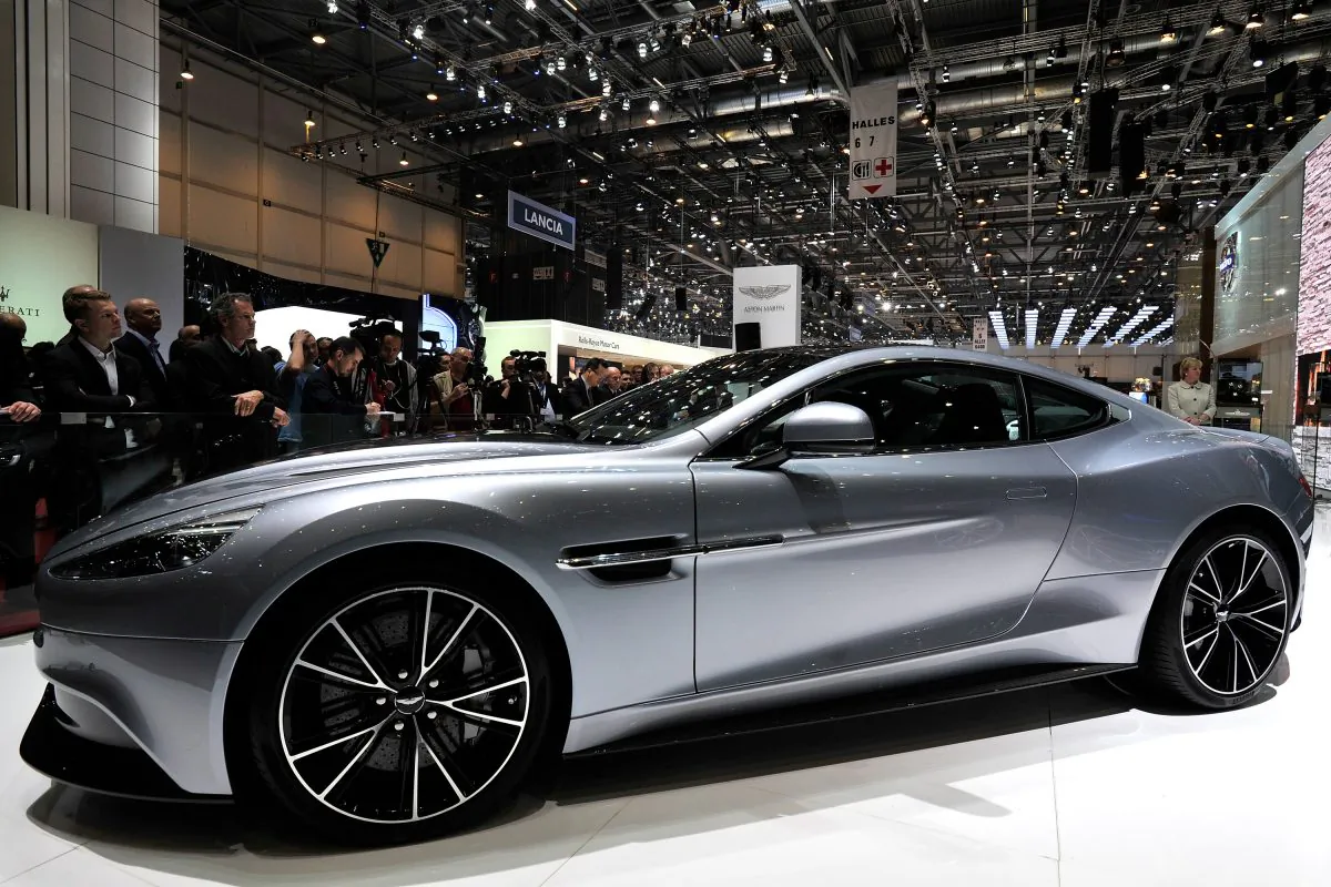 Visitors view the Aston Martin Vanquish during the 83rd Geneva Motor Show last March. The Vanquish will also be on display at the Ottawa Gatineau International Auto Show on March 20—23, 2014, at the Ottawa Convention Centre. (Harold Cunningham/Getty Images)