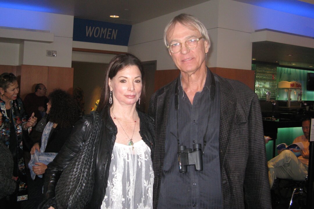 Bradley TePaske, Ph.D., and his wife, Arlene Landau, Ph.D., enjoy Shen Yun Performing Arts at the Nokia Theatre L.A. Live, on March 23. (Albert Roman/Epoch Times)