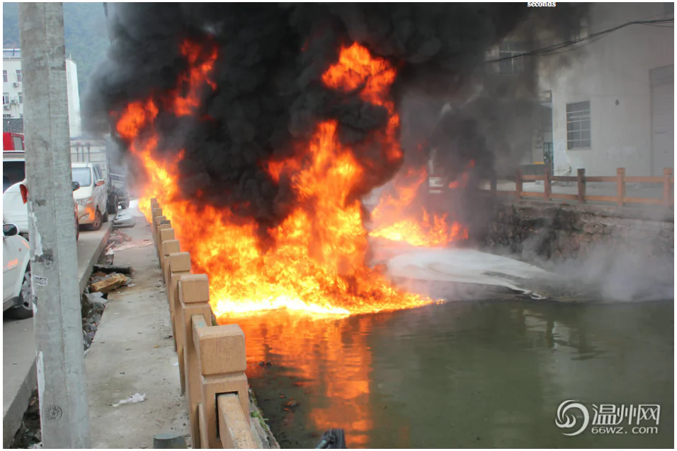 Screenshot showing a section of the Meiyu River on fire in Zhejiang Province. The blaze was thought to be due to pollution from a shoe-making factory that caught fire when a lit cigarette was thrown into the water. (Screenshot/Wenzhou News)
