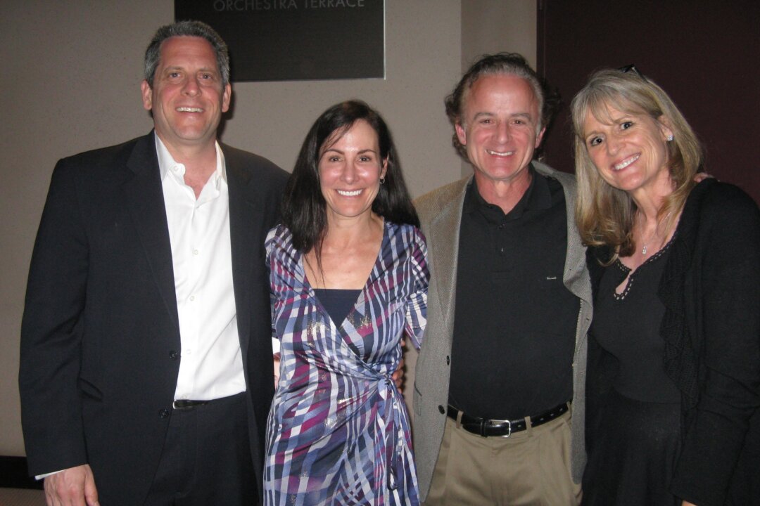 Dr. Kenneth James [L] and his wife, Mara, along with Dr. James Kurtzman, and his wife after enjoying an evening of Shen Yun Performing Arts, on March 15, at Segerstrom Center for the Arts. (Albert Roman/Epoch Times) 