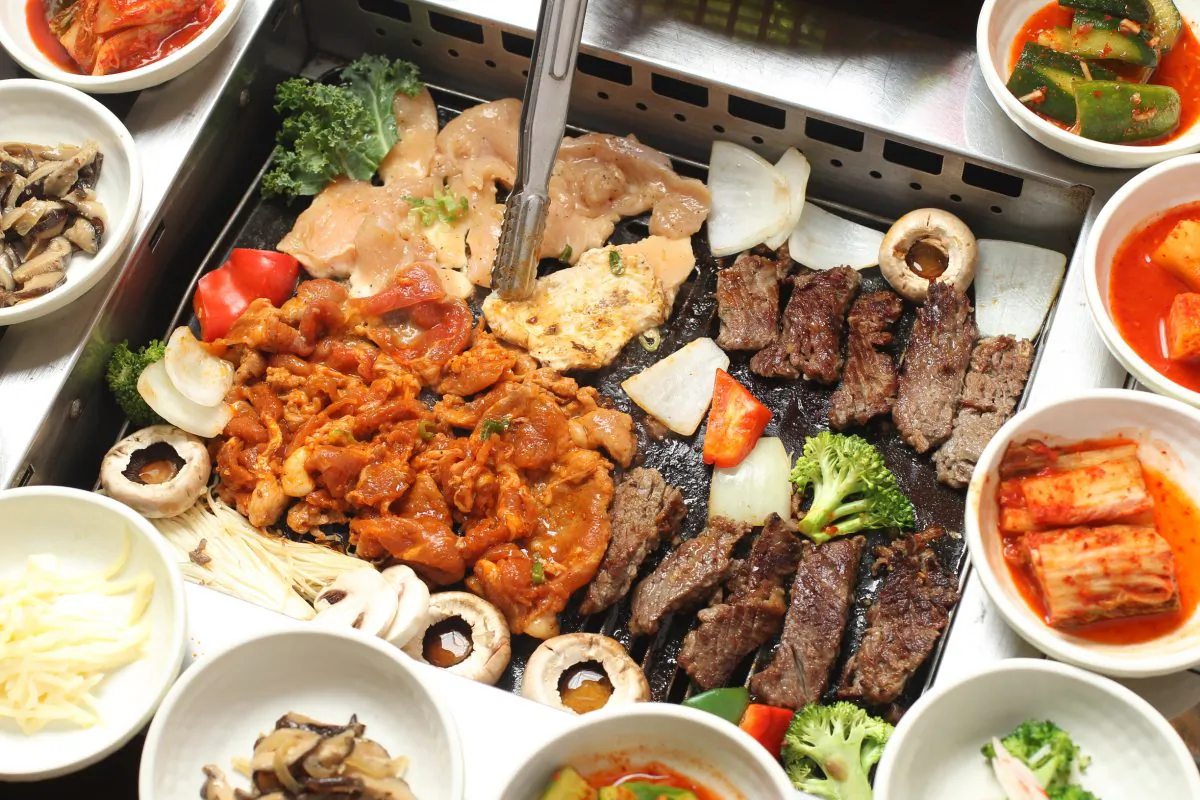 Korean barbecue, with an assortment of side dishes, or banchan. (Epoch Times)