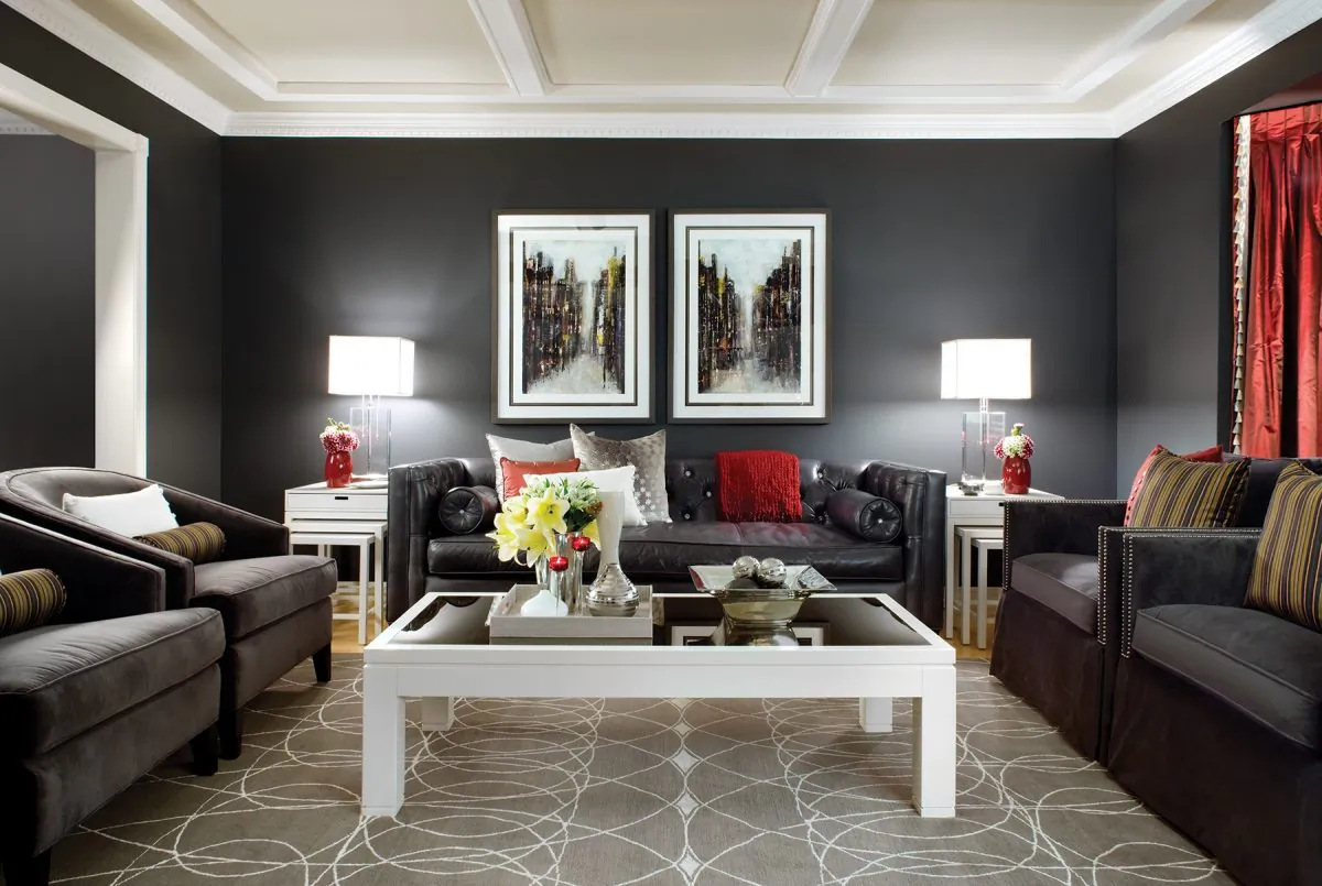  A dramatic colour scheme of grey, white, and red creates an inviting space. (Brandon Barré)