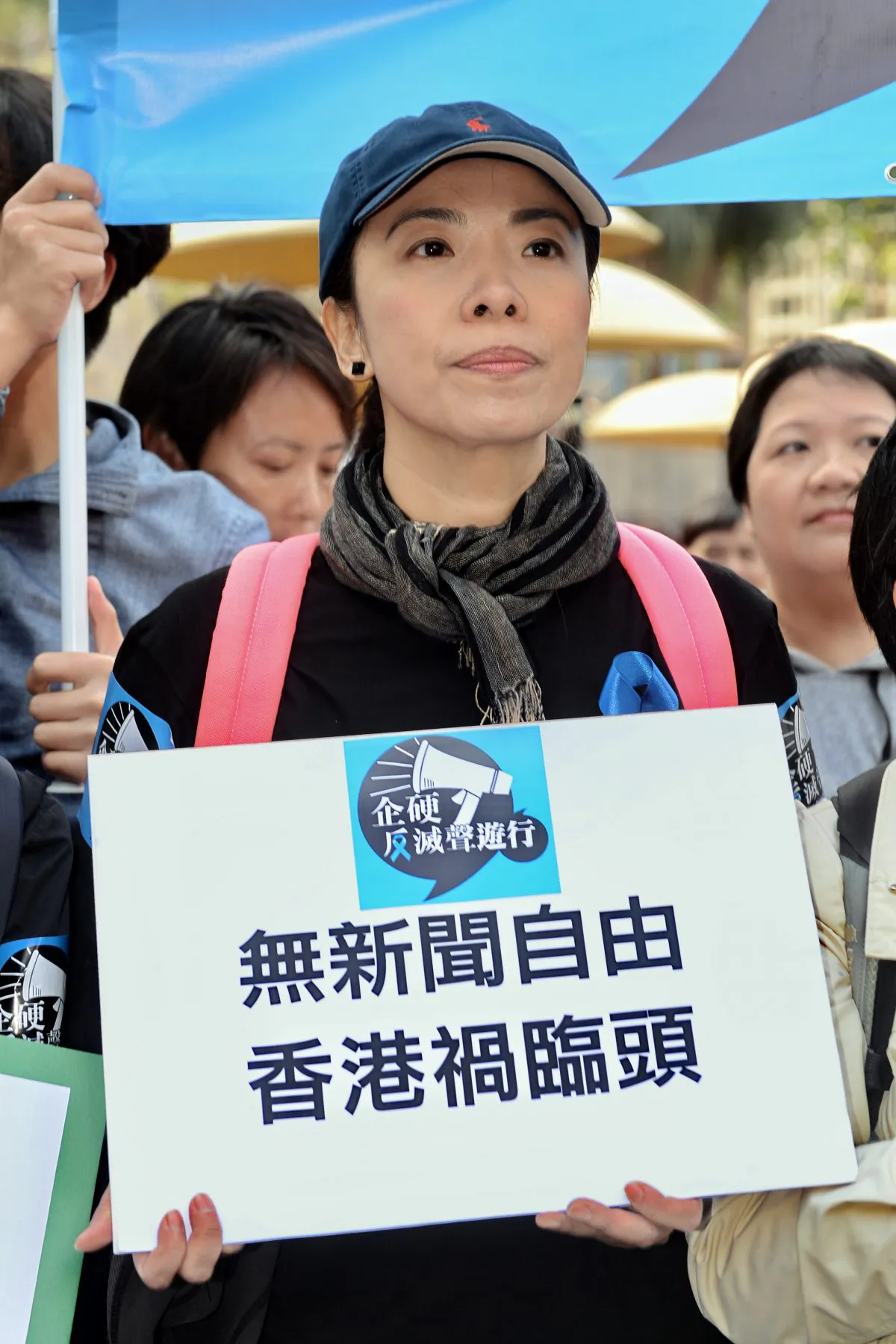 Li Wei-ling holds a sign that reads "Without press freedom, Hong Kong is in catastrophe," during the “Free Speech, Free Hong Kong” march on Feb. 23, 2014. (Epoch Times)