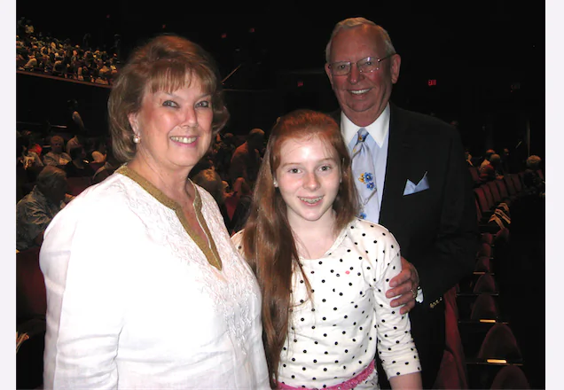 Sandra and Robert Graves with their goddaughter, Grace, enjoy Shen Yun Performing Arts at the Segerstrom Center for the Arts, on March 16. (Albert Roman /Epoch Times)