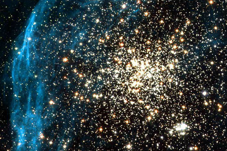 By spying on a neighboring galaxy, NASA's Hubble Space Telescope has captured an image of a young, globular-like star cluster—a type of object unknown in our Milky Way Galaxy. NASA, ESA, and Martino Romaniello (European Southern Observatory, Germany)  