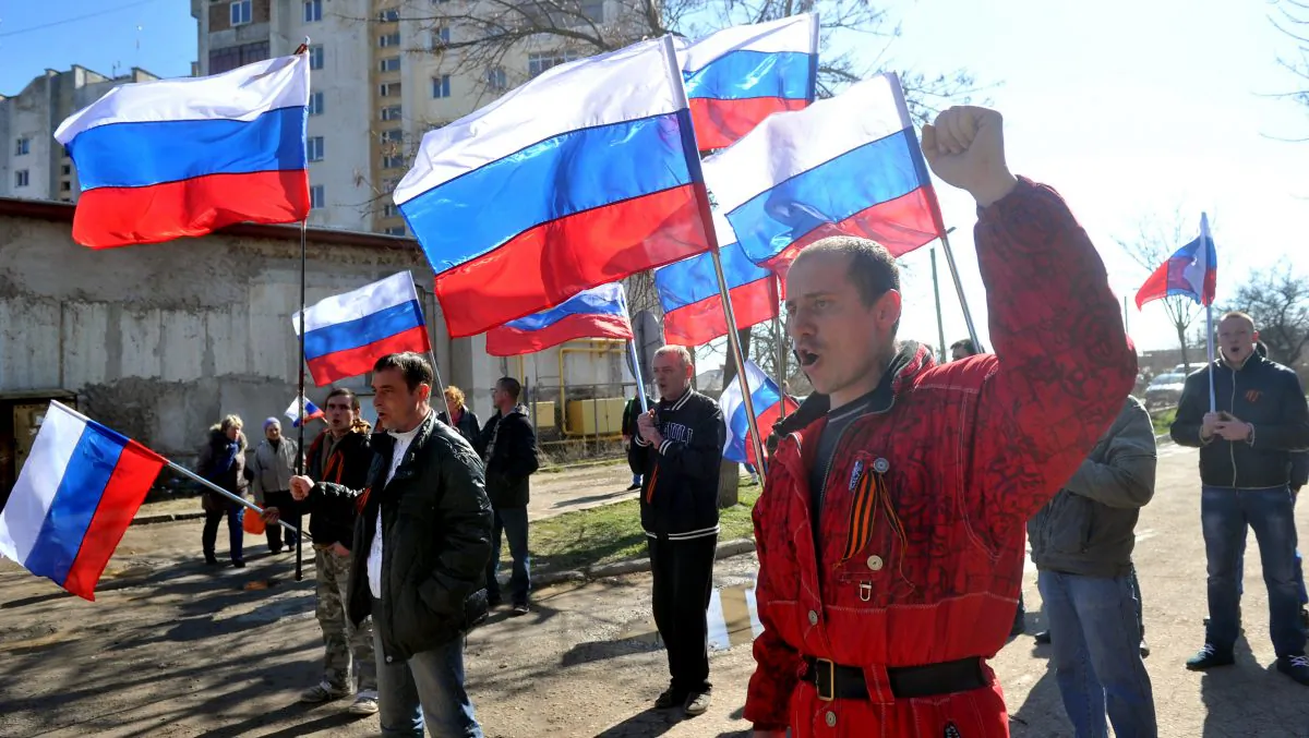 Pro-Russian activists rally in front of a Ukrainian anti-aircraft unit in the western Crimean city of Yevpatoria taken over partially by Russian troops on March 5, 2014. (Genya Savilov/AFP/Getty Images)