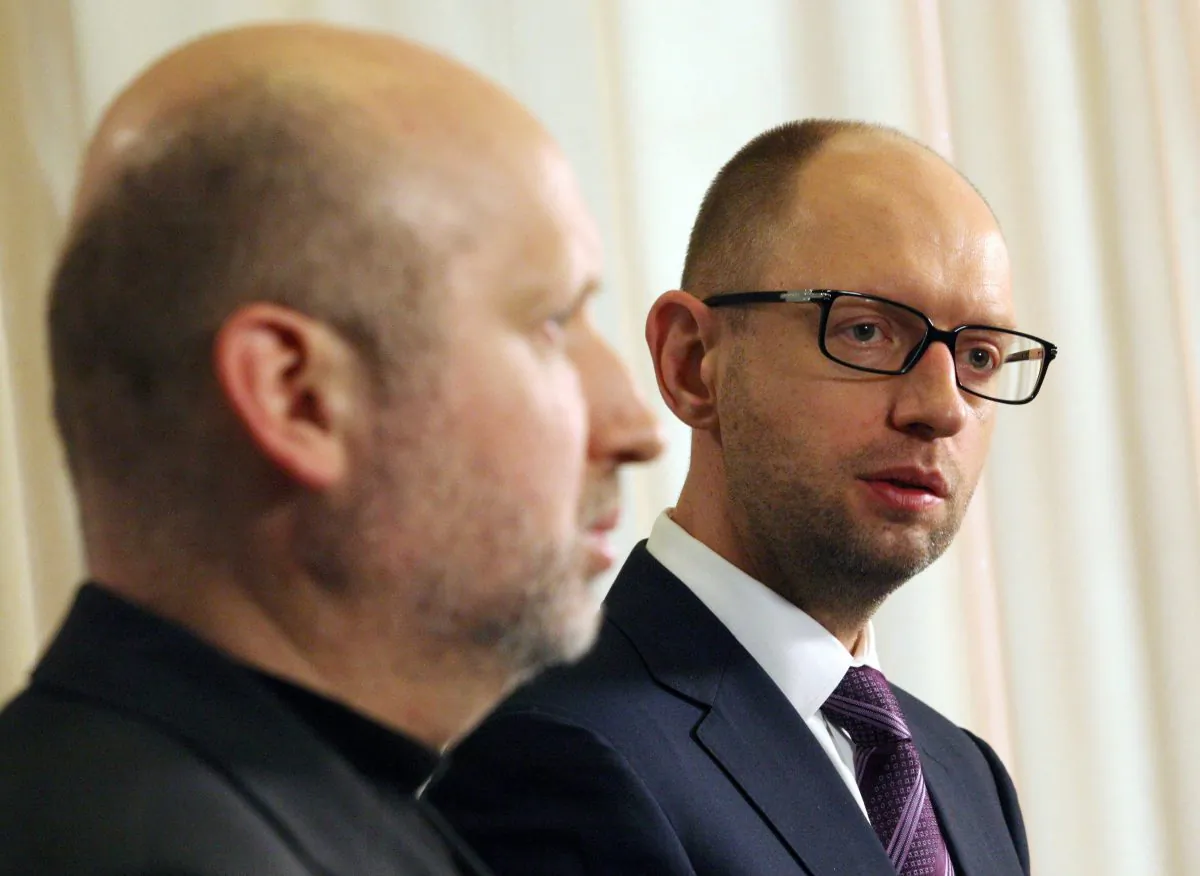 Ukrainian Prime Minister Arseniy Yatsenyuk (R) speaks to the media, flanked by Olexandr Turchynov, speaker of the Parliament and interim Ukrainian president, after closing a session of Parliament in Kyiv, March 2, 2014. (Anatolii Stepanov/AFP/Getty Images)