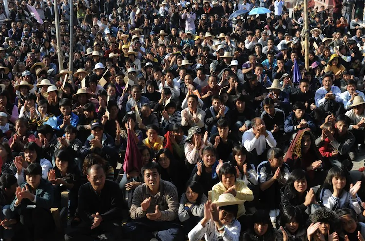 Wukan villagers listen to a speech by village leader Lin Zuluan in Wukan, Guangdong Province, Dec. 21, 2011, prior to democratic elections. Village chief Lin Zuluan has angered other elected village officials with lack of transparency in conducting village committee business, and not informing them that fired Party bosses had been re-appointed. (Mark Ralston/AFP/Getty Images)
